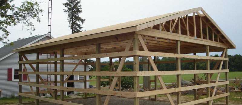 A perfect ensemble of wooden pole barn materials set up by professionals by Cedar Supply 